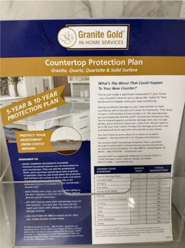Granite Gold in-home services countertop protection plan brochure on a showroom counter