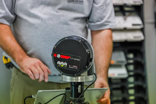 Close-up of the laser templating instrument used for precise countertop measurements
